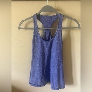 Lululemon, no attached bra. Figure-fitting, maybe loose at bottom